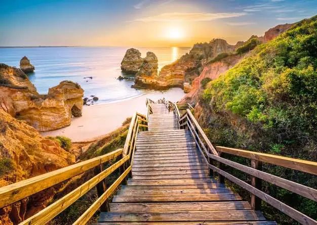 Ravensburger: Jigsaw Puzzle Stairway to Camilo Beach, Algarve 1000 Pc Puzzle - GamesLand Canada